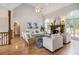 Bright living room with fireplace, vaulted ceilings, hardwood floors and ample natural light at 108 Faraday Dr, Douglasville, GA 30134