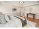 Spacious main bedroom with a tray ceiling, hardwood floors, and neutral décor at 108 Faraday Dr, Douglasville, GA 30134