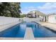 Backyard pool with diving board and white fence at 108 Faraday Dr, Douglasville, GA 30134