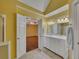 This bathroom features a marble vanity with double sinks and bright overhead lighting at 2018 Township Dr, Woodstock, GA 30189