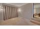 Bonus room perfect for many uses; features neutral decor and carpeted floors at 2018 Township Dr, Woodstock, GA 30189