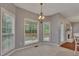 Well-lit dining area with large windows and easy access to outdoor deck at 2018 Township Dr, Woodstock, GA 30189