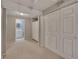 Hallway with closet doors leading to a bathroom with a vanity at 2018 Township Dr, Woodstock, GA 30189