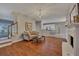 Open living room with fireplace connects to the kitchen area at 2018 Township Dr, Woodstock, GA 30189