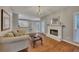 Spacious living room with fireplace connects to the kitchen and dining area at 2018 Township Dr, Woodstock, GA 30189
