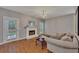 Comfortable living room features hardwood floors, fireplace, and a walkout to deck at 2018 Township Dr, Woodstock, GA 30189