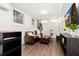 Basement living area features tile flooring, a leather couch, and a large screen TV at 677 Holmes Nw St, Atlanta, GA 30318