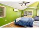 Bright and spacious bedroom with hardwood floors, a large window, and modern amenities, creating a serene and comfortable retreat at 677 Holmes Nw St, Atlanta, GA 30318