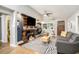 Inviting living room with a modern fireplace, stylish decor, and abundant natural light, perfect for relaxing or entertaining at 677 Holmes Nw St, Atlanta, GA 30318