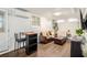 Finished basement offers a living area with wood floors, mini-split unit, and natural light at 677 Holmes Nw St, Atlanta, GA 30318