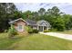Well-maintained home featuring a stone facade and pleasant front yard with green grass at 6770 Gordon Manor Sw Ct, Mableton, GA 30126