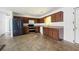 Functional kitchen features dark appliances, great for cooking and renovations at 6770 Gordon Manor Sw Ct, Mableton, GA 30126