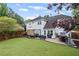 Expansive backyard with a patio, hot tub, and lush lawn at 10735 Pinewalk Forest Cir, Alpharetta, GA 30022