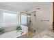 Bright bathroom featuring a jacuzzi tub, tiled shower, and granite countertops at 10735 Pinewalk Forest Cir, Alpharetta, GA 30022