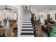 Elegant entryway with hardwood floors and staircase leading to the upper level at 10735 Pinewalk Forest Cir, Alpharetta, GA 30022