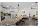 Well-lit kitchen featuring a large island with seating, stainless steel appliances, and an open layout at 10735 Pinewalk Forest Cir, Alpharetta, GA 30022