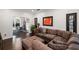 Cozy living room with a plush sectional sofa and views into the adjoining dining area at 10735 Pinewalk Forest Cir, Alpharetta, GA 30022
