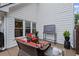 Inviting outdoor patio features comfortable seating and a television at 10735 Pinewalk Forest Cir, Alpharetta, GA 30022