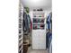 Walk-in closet with custom shelving, drawers, and ample space for clothes and accessories at 10735 Pinewalk Forest Cir, Alpharetta, GA 30022