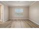Tranquil bedroom with new flooring, a tray ceiling, and plenty of natural light at 1501 Buckingham, Stockbridge, GA 30281