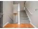 Inviting foyer featuring wood floors, stairs to the upper level, and access to the lower level at 1501 Buckingham, Stockbridge, GA 30281