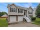Charming two-story home with a two-car garage and well-maintained landscaping at 1501 Buckingham, Stockbridge, GA 30281