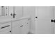 Bathroom with white cabinets, granite countertop, and modern black hardware at 152 Palisade Dr, Rydal, GA 30171