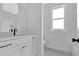 Modern bathroom with marble walk-in shower, white vanity, and stylish fixtures at 152 Palisade Dr, Rydal, GA 30171