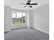 Cozy bedroom with large window offering views of the surrounding landscape at 152 Palisade Dr, Rydal, GA 30171