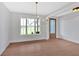 Dining room features hardwood floors, view to exterior, and chandelier lighting at 152 Palisade Dr, Rydal, GA 30171