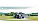 Attractive two-story home with a blend of dark and white siding, nestled in a scenic landscape at 152 Palisade Dr, Rydal, GA 30171