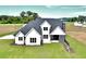 Modern two-story home with black framed windows and a lush green lawn at 152 Palisade Dr, Rydal, GA 30171