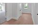 Hallway area with wood floors and several entrances to other rooms at 152 Palisade Dr, Rydal, GA 30171