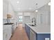 Kitchen featuring white cabinets, center island, quartz countertops, and stainless appliances at 152 Palisade Dr, Rydal, GA 30171