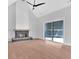 Living room featuring hardwood floors, stone fireplace, and vaulted ceilings at 152 Palisade Dr, Rydal, GA 30171