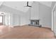 Living room featuring hardwood floors, stone fireplace, and vaulted ceilings at 152 Palisade Dr, Rydal, GA 30171