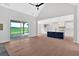 Bright, open-concept living space with hardwood floors and a kitchen island with pendant lighting at 152 Palisade Dr, Rydal, GA 30171