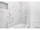 Shower with marble tile design and a built in niche at 152 Palisade Dr, Rydal, GA 30171