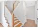 Elegant staircase with white rails and wood steps leads to the upper level at 152 Palisade Dr, Rydal, GA 30171