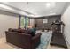 Basement recreation room complete with a couch, treadmill, and natural light at 2804 Stillwater Park Dr, Marietta, GA 30066