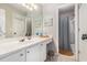 Clean bathroom featuring a white vanity with a sink and a shower behind a gray curtain at 2804 Stillwater Park Dr, Marietta, GA 30066