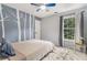 Serene bedroom with calming blue wall art and a window overlooking trees at 2804 Stillwater Park Dr, Marietta, GA 30066