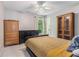 Bedroom features an earth-tone color palette, a ceiling fan, and built in shelves at 2804 Stillwater Park Dr, Marietta, GA 30066