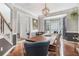 Elegant dining room featuring a large wood table, bay windows, and chandelier at 2804 Stillwater Park Dr, Marietta, GA 30066