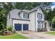 Elegant two-story home with a manicured lawn, two car garage, and pristine curb appeal at 2804 Stillwater Park Dr, Marietta, GA 30066
