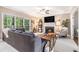 Cozy living room with fireplace, large windows, and comfortable gray sofa at 2804 Stillwater Park Dr, Marietta, GA 30066