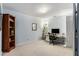 A bright, spacious office area provides the ideal space for remote work, including a large wooden bookshelf at 2804 Stillwater Park Dr, Marietta, GA 30066