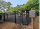 Fenced playground area for children with a play structure and safety signage at 2804 Stillwater Park Dr, Marietta, GA 30066