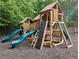 Well-equipped wooden playground with slides, climbing wall, and platforms for enjoyment at 2804 Stillwater Park Dr, Marietta, GA 30066
