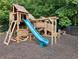 Fun wooden playground structure with a slide and climbing features for active  at 2804 Stillwater Park Dr, Marietta, GA 30066